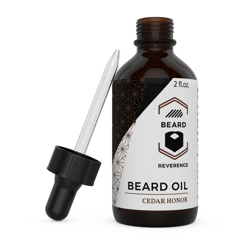 Beard Reverence Cedar Honor Beard Oil with dropper top laying next to it. 