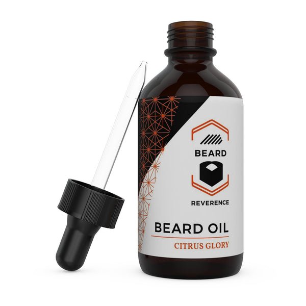 Beard Reverence Citrus Glory Beard Oil with dropper top laying next to it. 